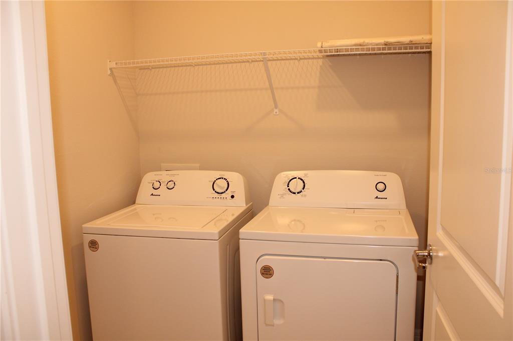 8232 Reefbay Cove Parrish, FL 34221 - Photo 35 of 64 a utility room with dryer and washer