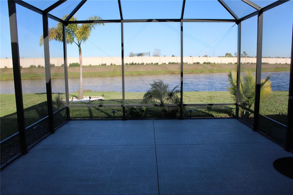 8232 Reefbay Cove Parrish, FL 34221 - Photo 37 of 64 a view of a glass door with a floor to ceiling window