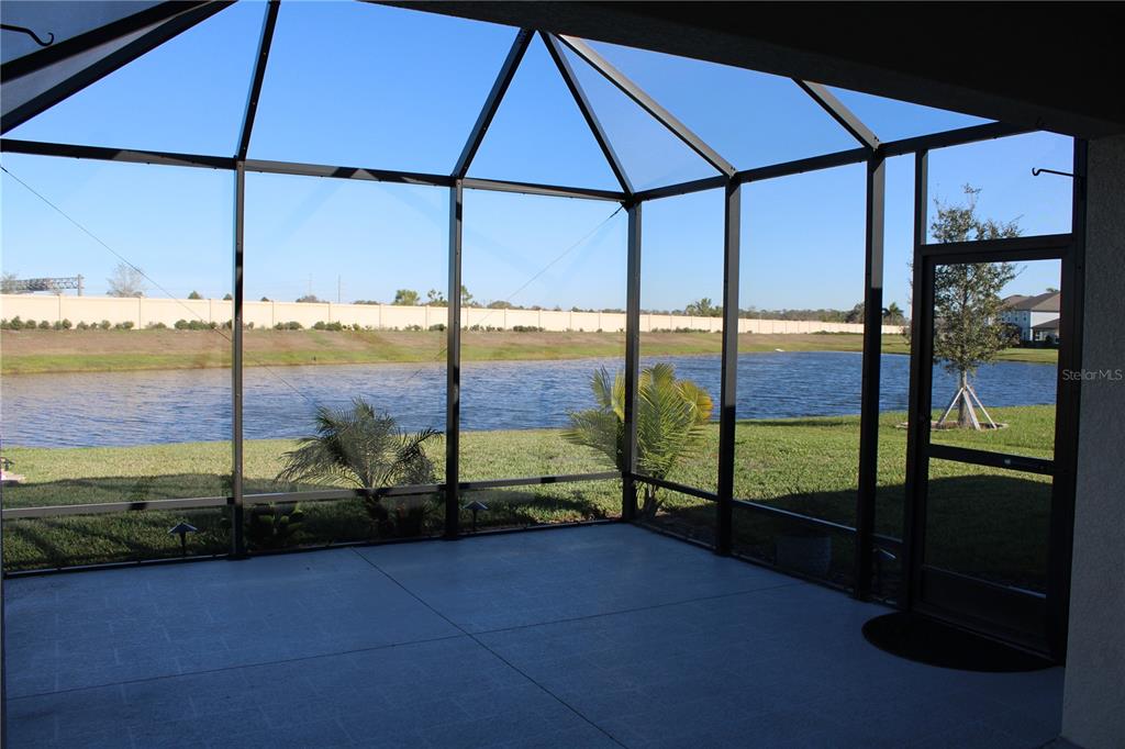 8232 Reefbay Cove Parrish, FL 34221 - Photo 38 of 64 a view of a glass door with a floor to ceiling window