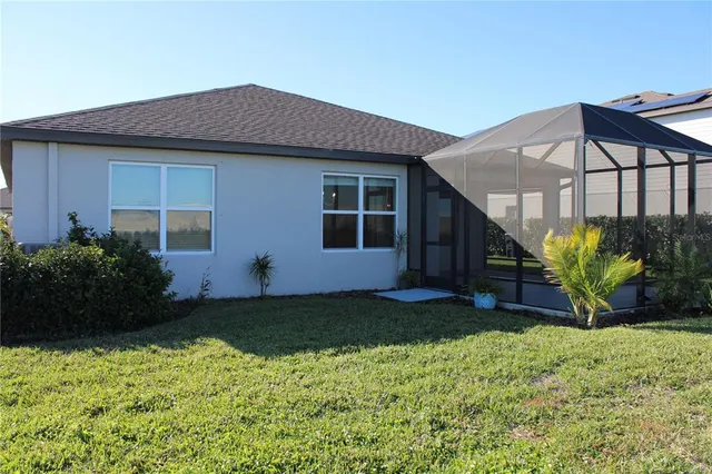 a kitchen with a sink cabinets and wooden floor