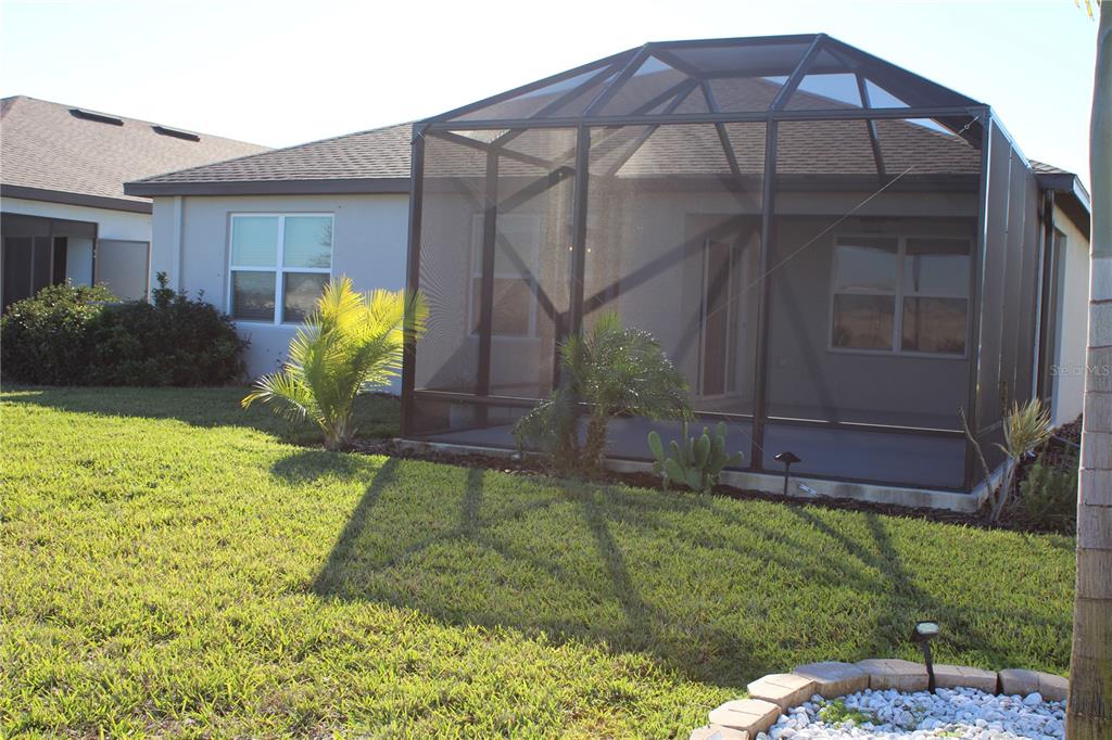 8232 Reefbay Cove Parrish, FL 34221 - Photo 48 of 64 a view of a house with a yard