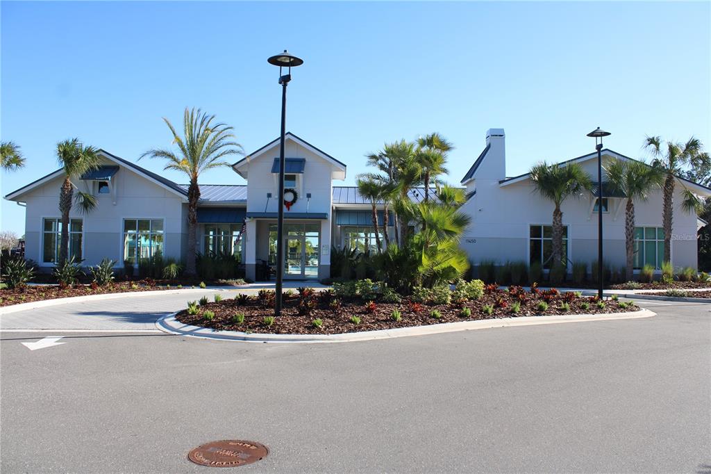 8232 Reefbay Cove Parrish, FL 34221 - Photo 49 of 64 a front view of a house with a yard