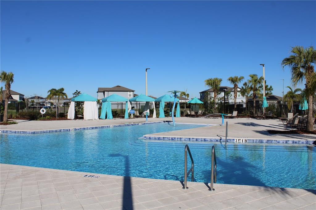 8232 Reefbay Cove Parrish, FL 34221 - Photo 52 of 64 a view of a swimming pool with outdoor seating