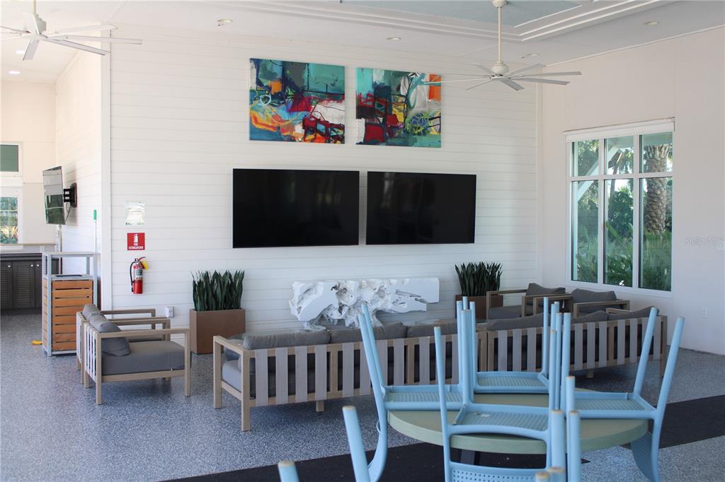 8232 Reefbay Cove Parrish, FL 34221 - Photo 55 of 64 a living room with furniture fireplace and flat screen tv