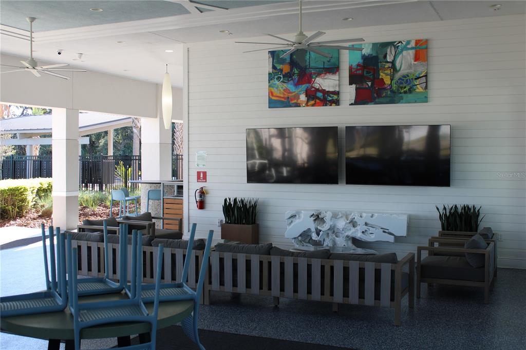 8232 Reefbay Cove Parrish, FL 34221 - Photo 57 of 64 a living room with furniture and a flat screen tv