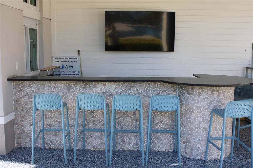 8232 Reefbay Cove Parrish, FL 34221 - Photo 59 of 64 a kitchen with a cabinets and a fireplace