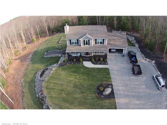 131 Gibson Hill Road Sterling, CT 06377 - Photo 1 of 1 a aerial view of a house with garden