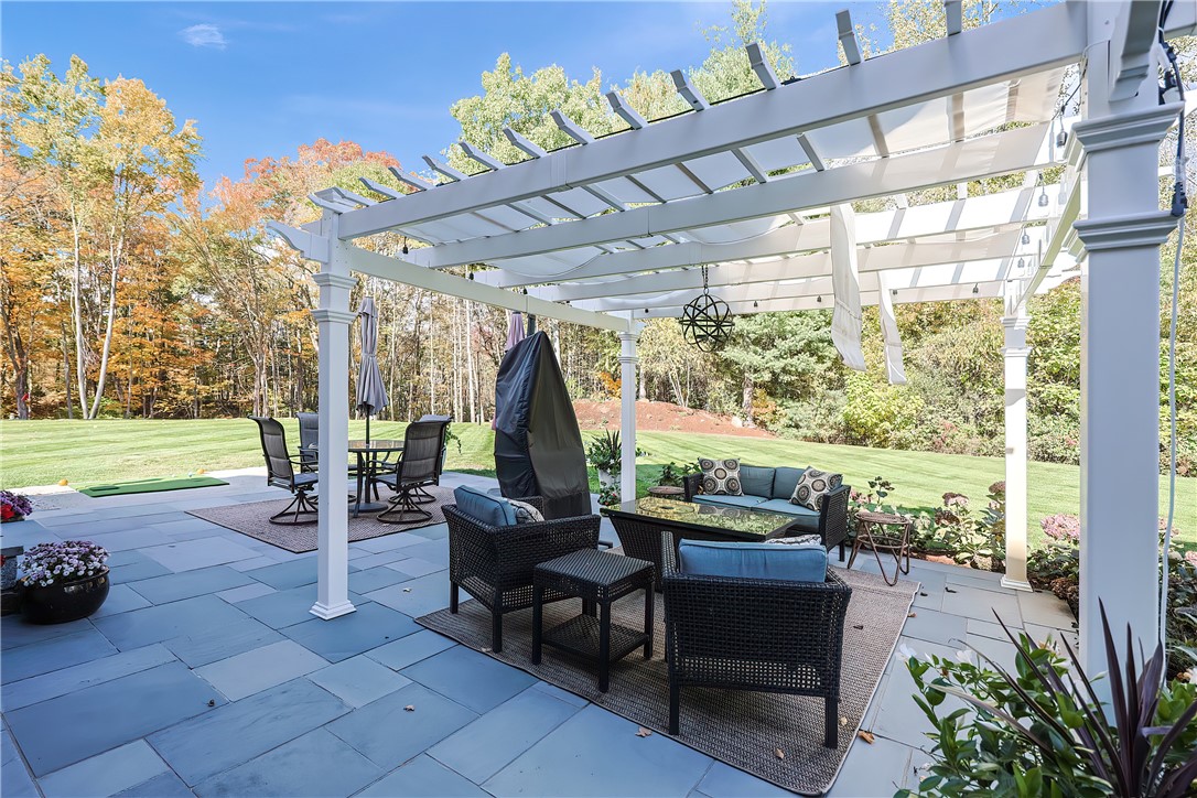 321 Greenville Road North Smithfield, RI 02896 - Photo 39 of 50 Bluestone patio overlooks wooded landscape
