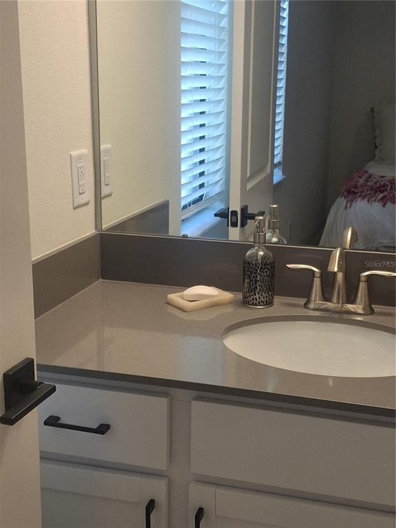 12618 Vander Way New Port Richey, FL 34654 - Photo 15 of 22 a bathroom with a sink and a mirror