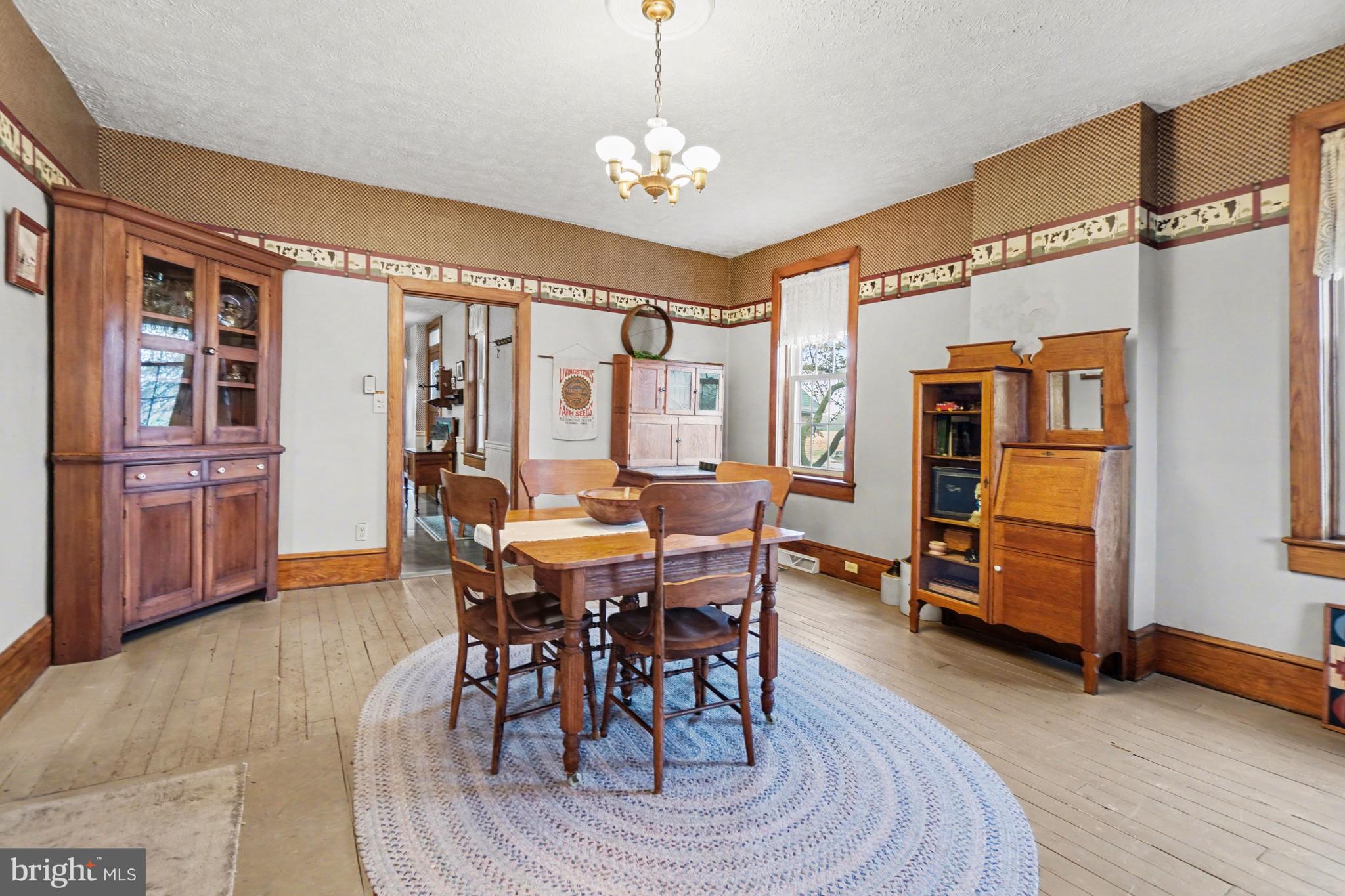 5505 Olde Scotland Road Shippensburg, PA 17257 - Photo 16 of 50 a dining room with furniture window and wooden floor