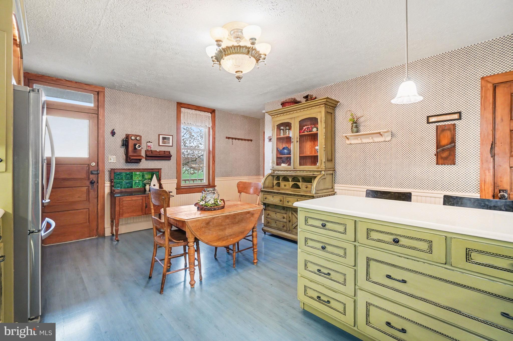 5505 Olde Scotland Road Shippensburg, PA 17257 - Photo 19 of 50 a room with chandelier furniture and a wooden floor