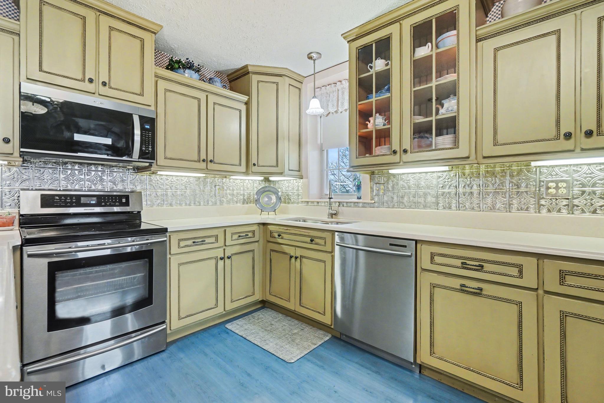 5505 Olde Scotland Road Shippensburg, PA 17257 - Photo 20 of 50 a kitchen with stainless steel appliances granite countertop a stove microwave and sink
