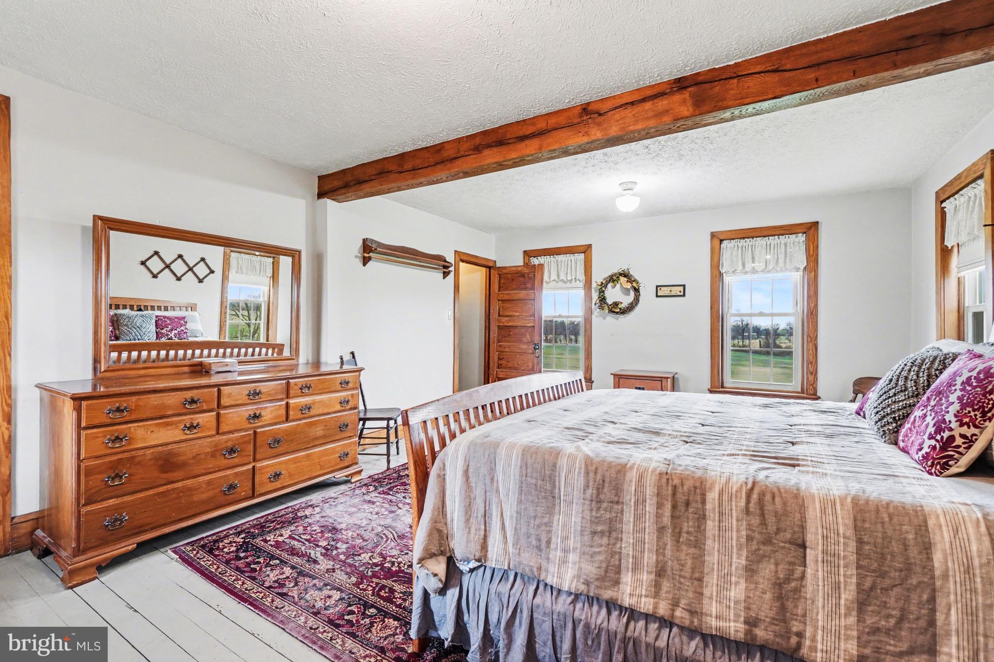 5505 Olde Scotland Road Shippensburg, PA 17257 - Photo 21 of 50 a bedroom with a bed and wooden floor