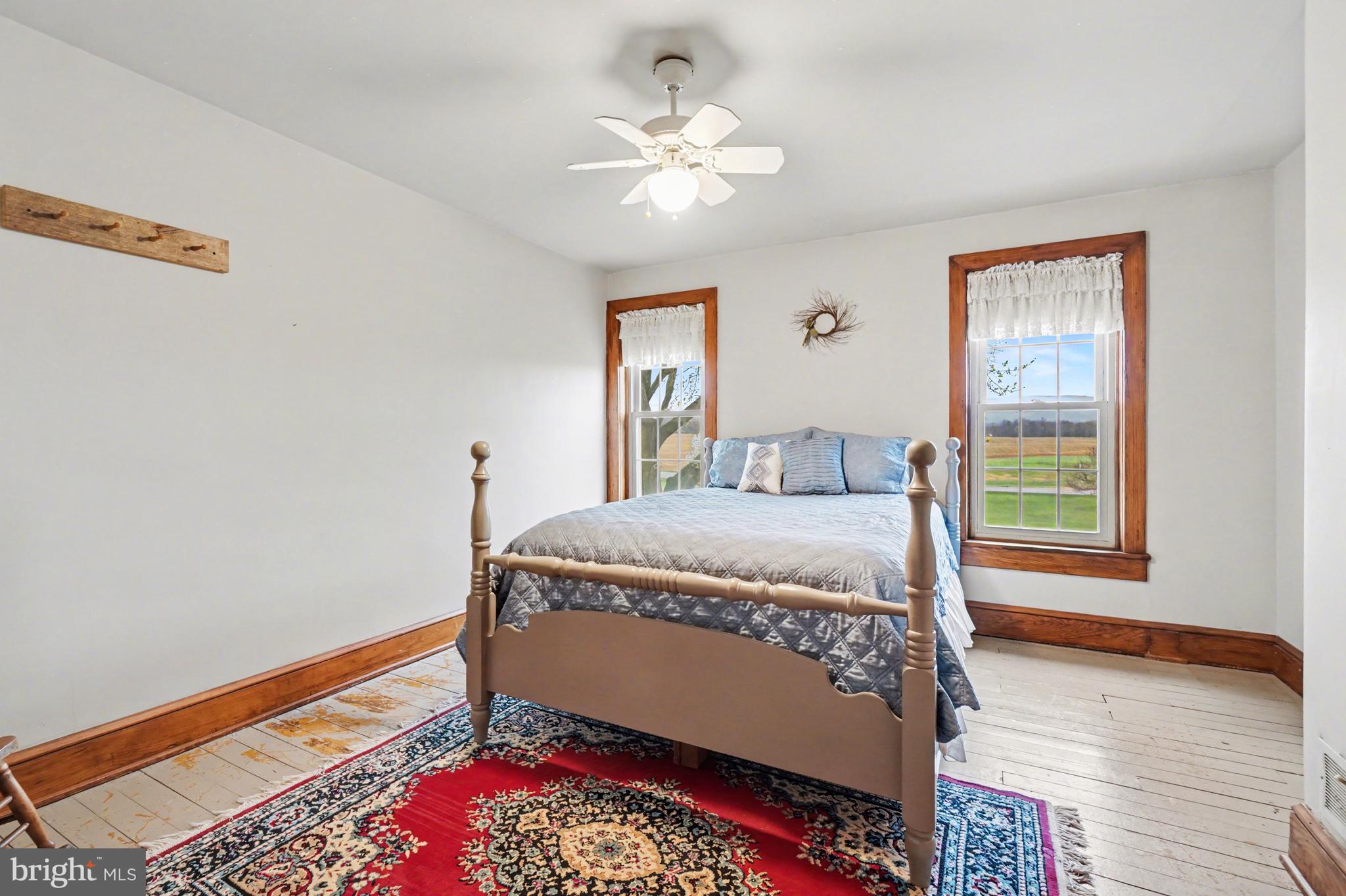 5505 Olde Scotland Road Shippensburg, PA 17257 - Photo 25 of 50 a bed sitting in a bedroom next to a window