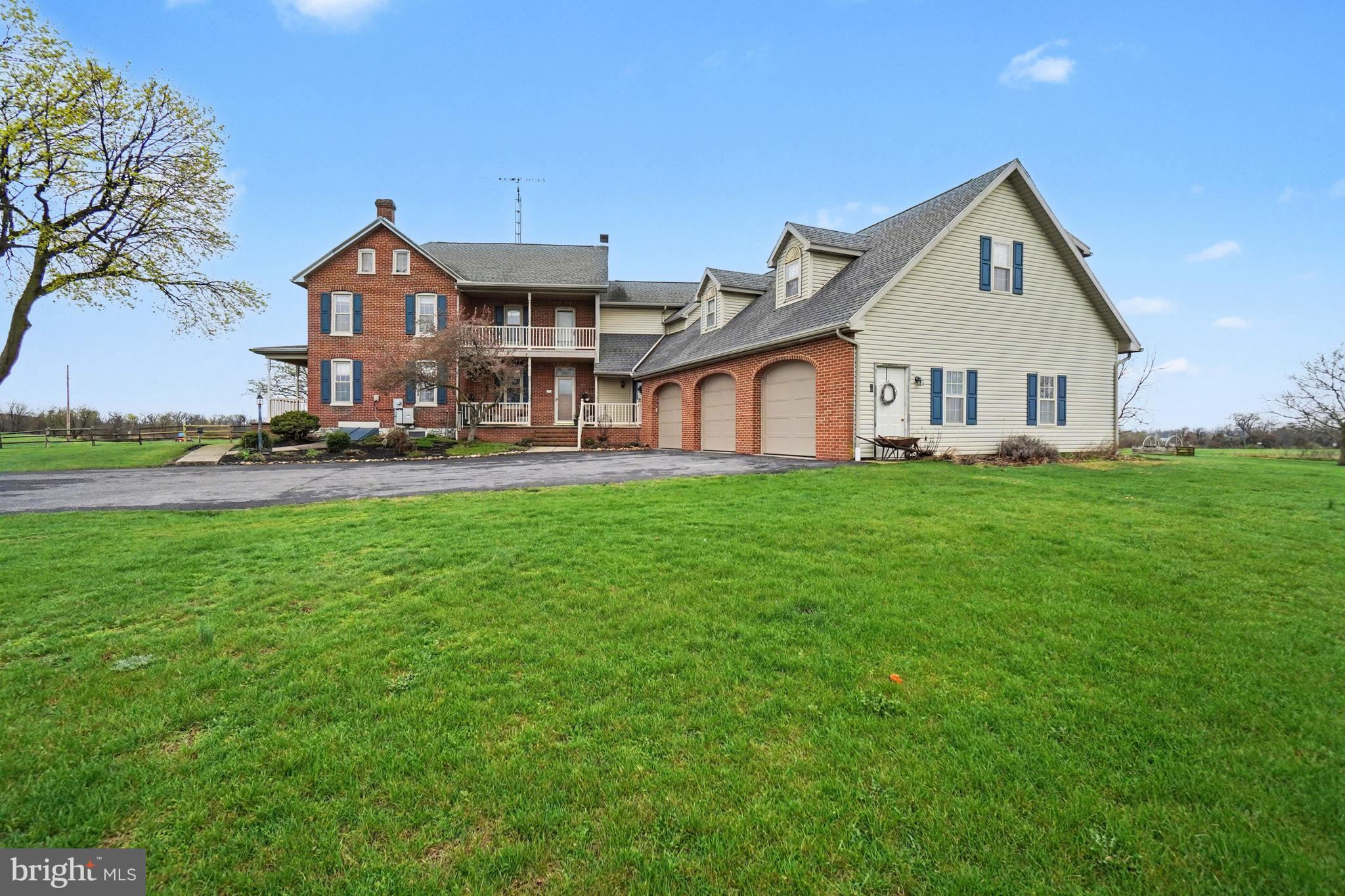 5505 Olde Scotland Road Shippensburg, PA 17257 - Photo 39 of 50 a front view of a house with a yard and garage