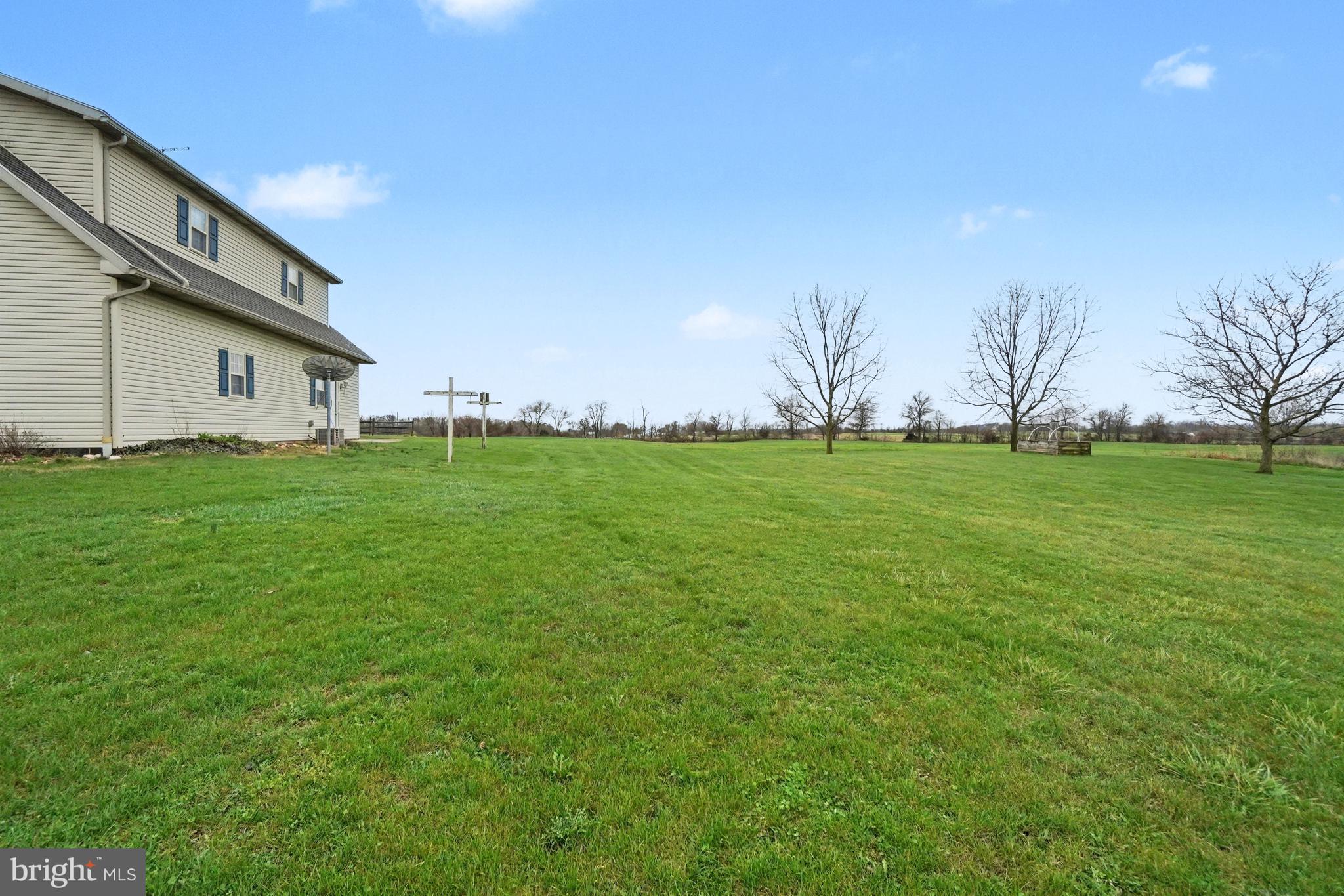 5505 Olde Scotland Road Shippensburg, PA 17257 - Photo 41 of 50 a backyard of a house with lots of green space and trees