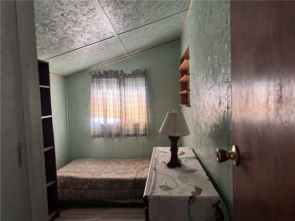 21188 South Cheyenne Road Yucca, AZ 86438 - Photo 11 of 24 Bedroom with vaulted ceiling