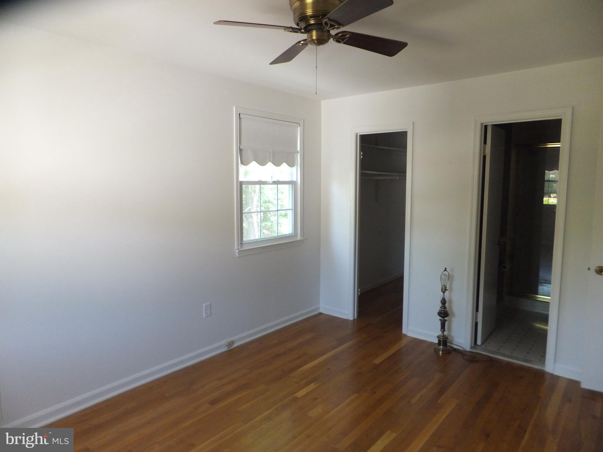 16205 Jerald Road Laurel, MD 20707 - Photo 32 of 47 MASTER BEDROOM w/ HARDWOOD FLOORING & CEILING FAN