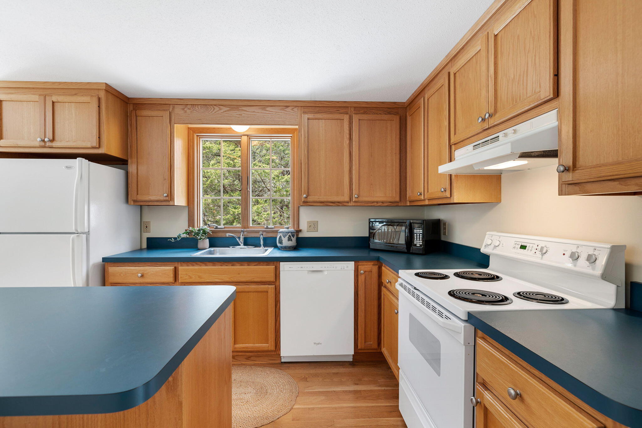 9 Raymond Way Eastham, MA 02642 - Photo 11 of 27 a kitchen with stainless steel appliances granite countertop a stove a sink and a refrigerator