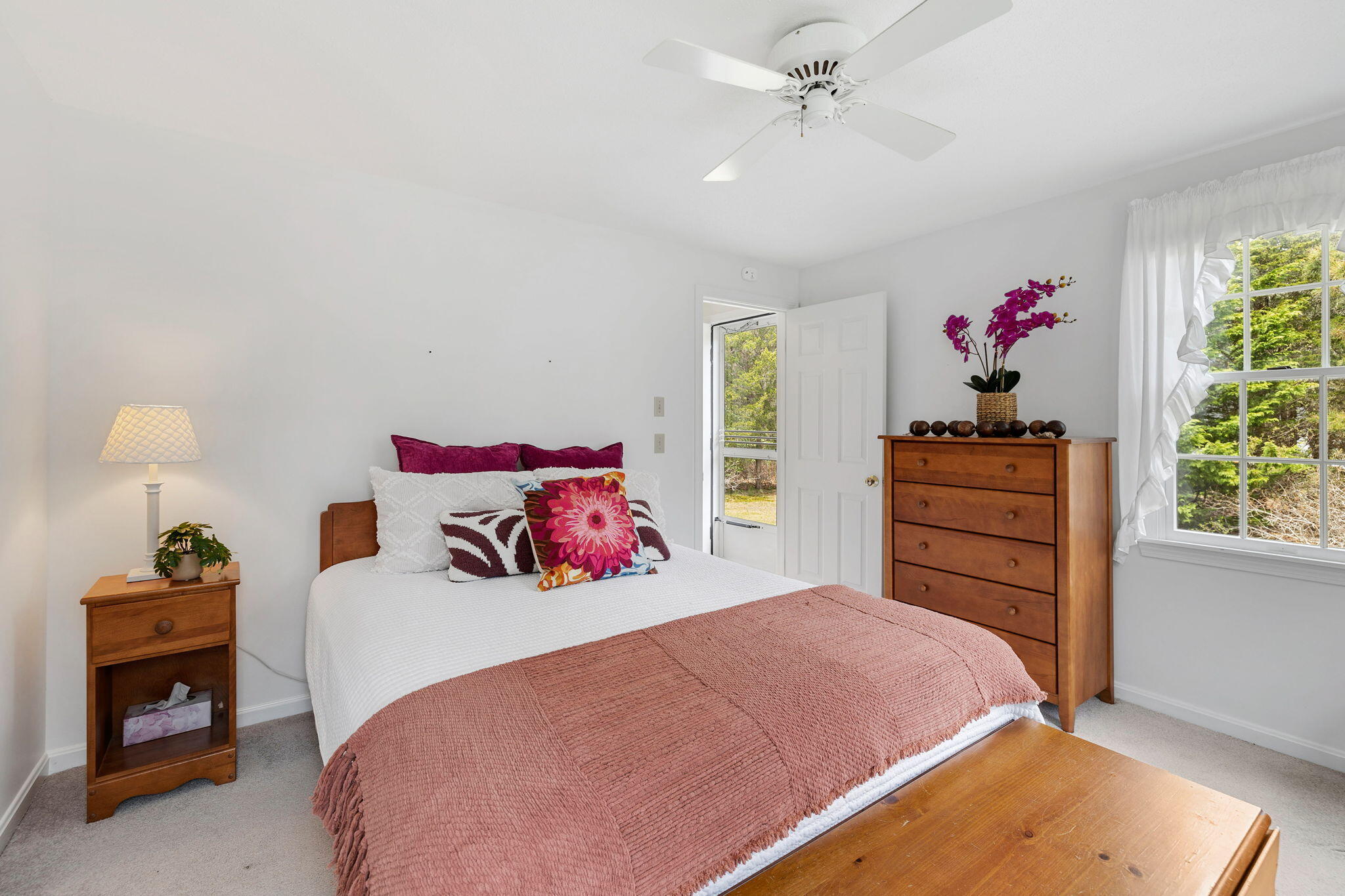 9 Raymond Way Eastham, MA 02642 - Photo 14 of 27 a bedroom with a bed and a chandelier