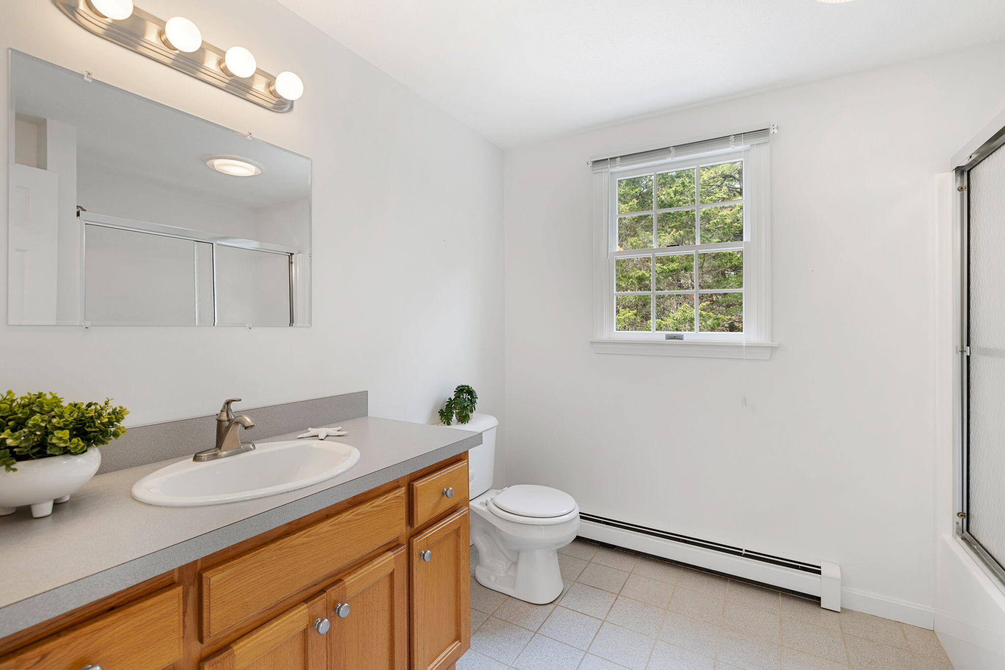 9 Raymond Way Eastham, MA 02642 - Photo 16 of 27 a bathroom with a sink vanity granite and toilet