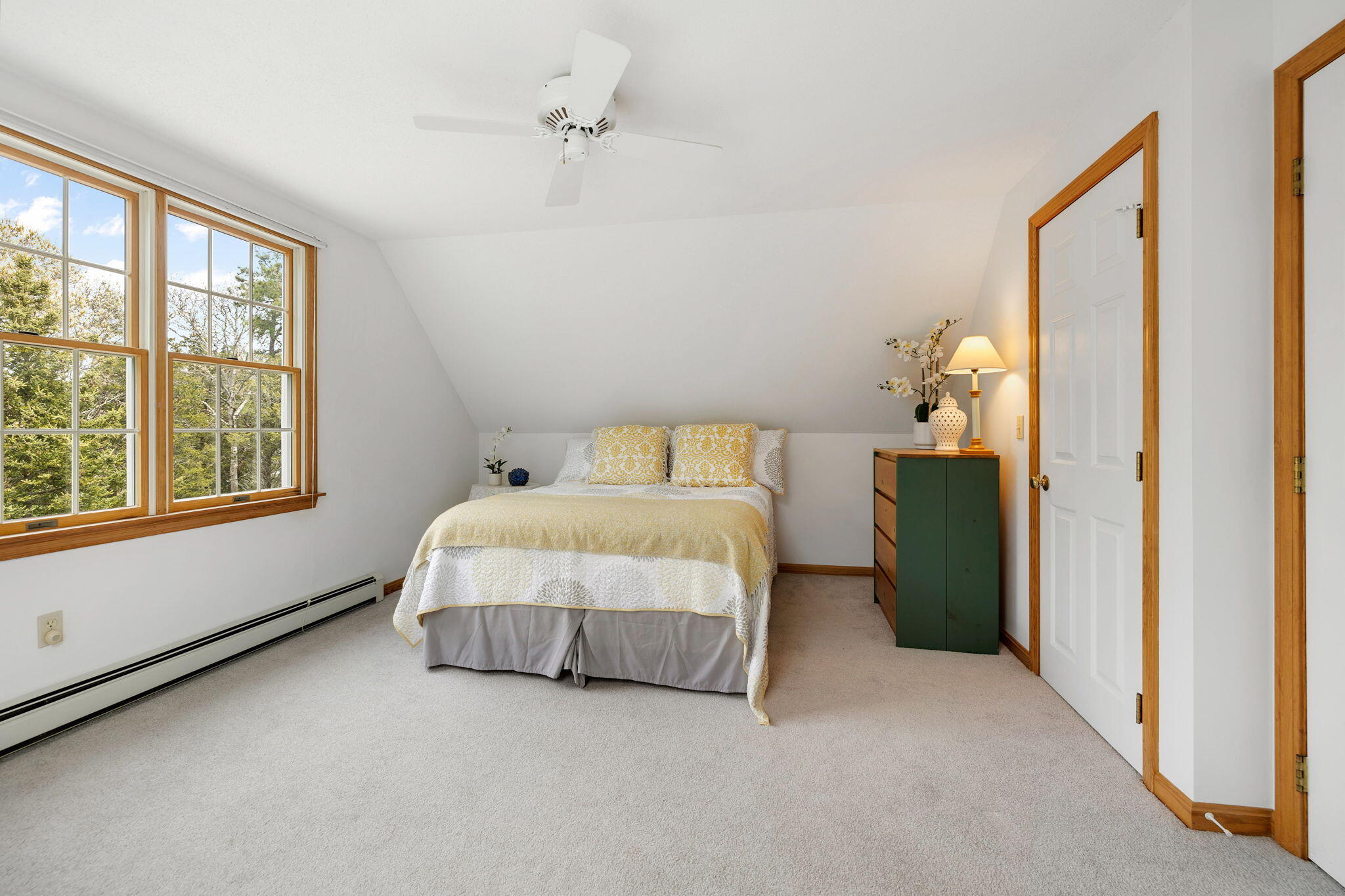 9 Raymond Way Eastham, MA 02642 - Photo 19 of 27 a spacious bedroom with a bed and a window