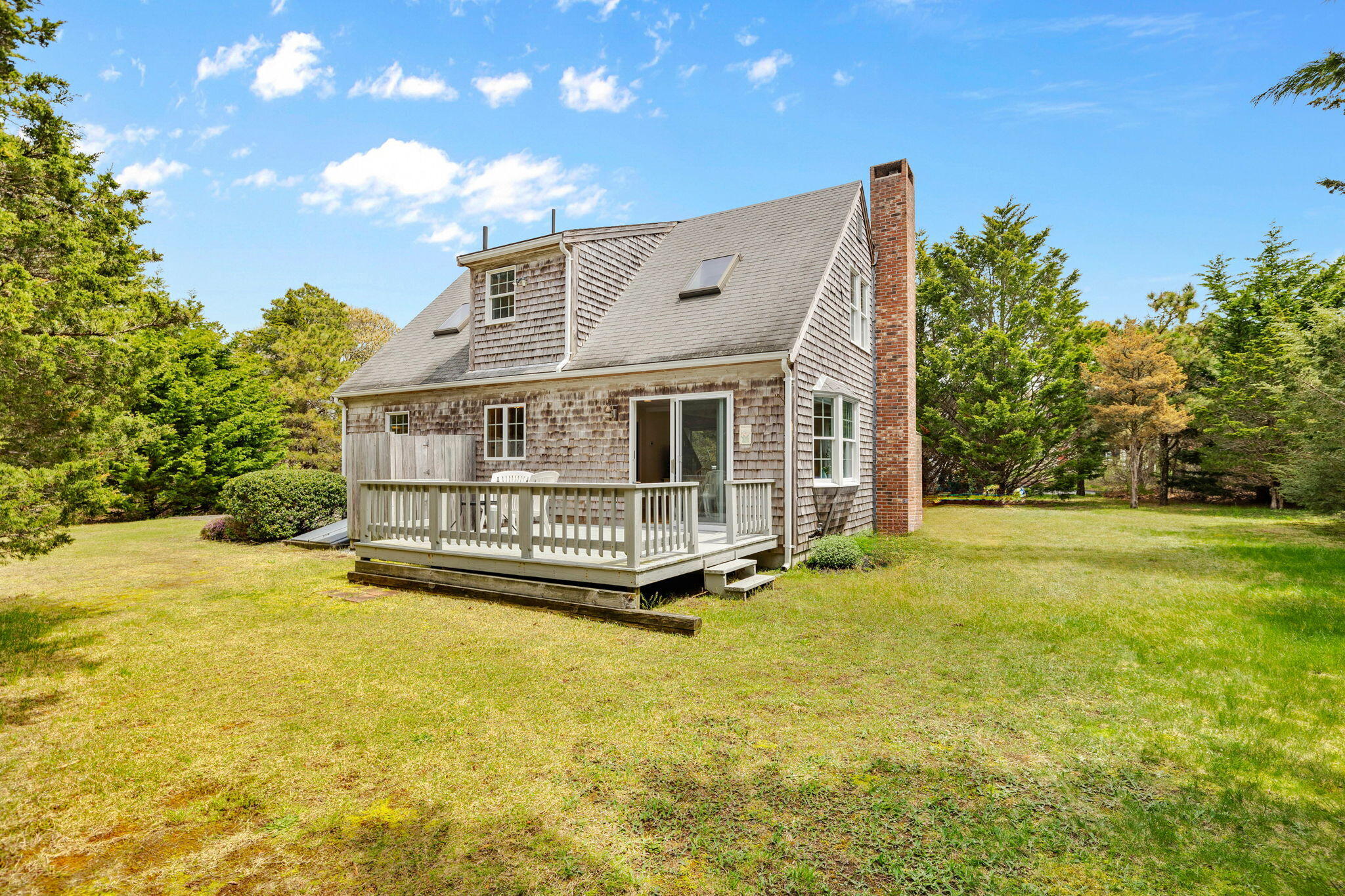 9 Raymond Way Eastham, MA 02642 - Photo 2 of 27 a view of swimming pool with lawn chairs and plants