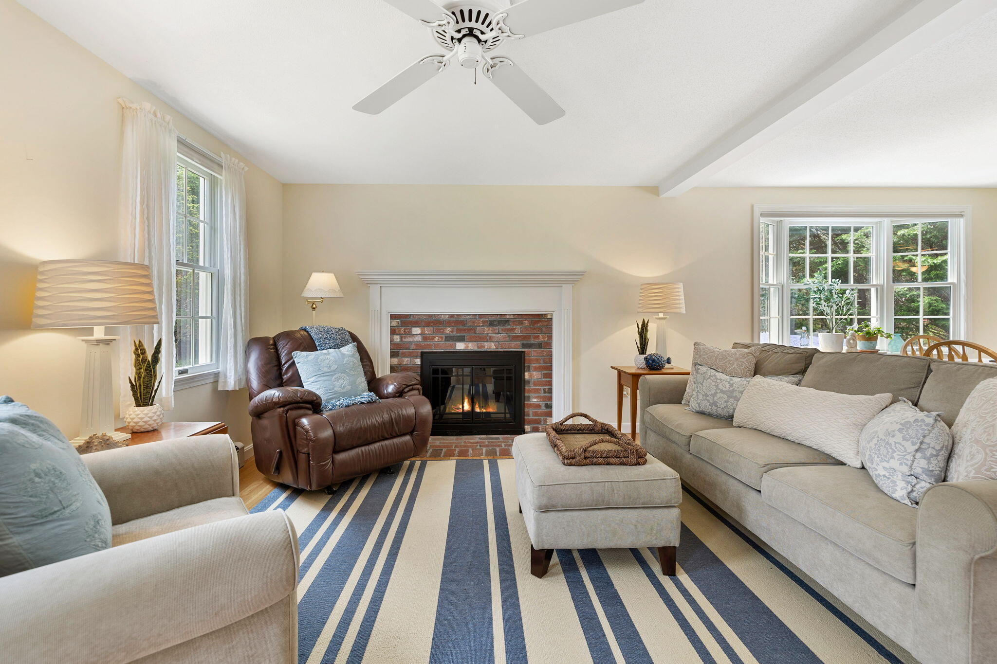 9 Raymond Way Eastham, MA 02642 - Photo 4 of 27 a living room with furniture and a fireplace