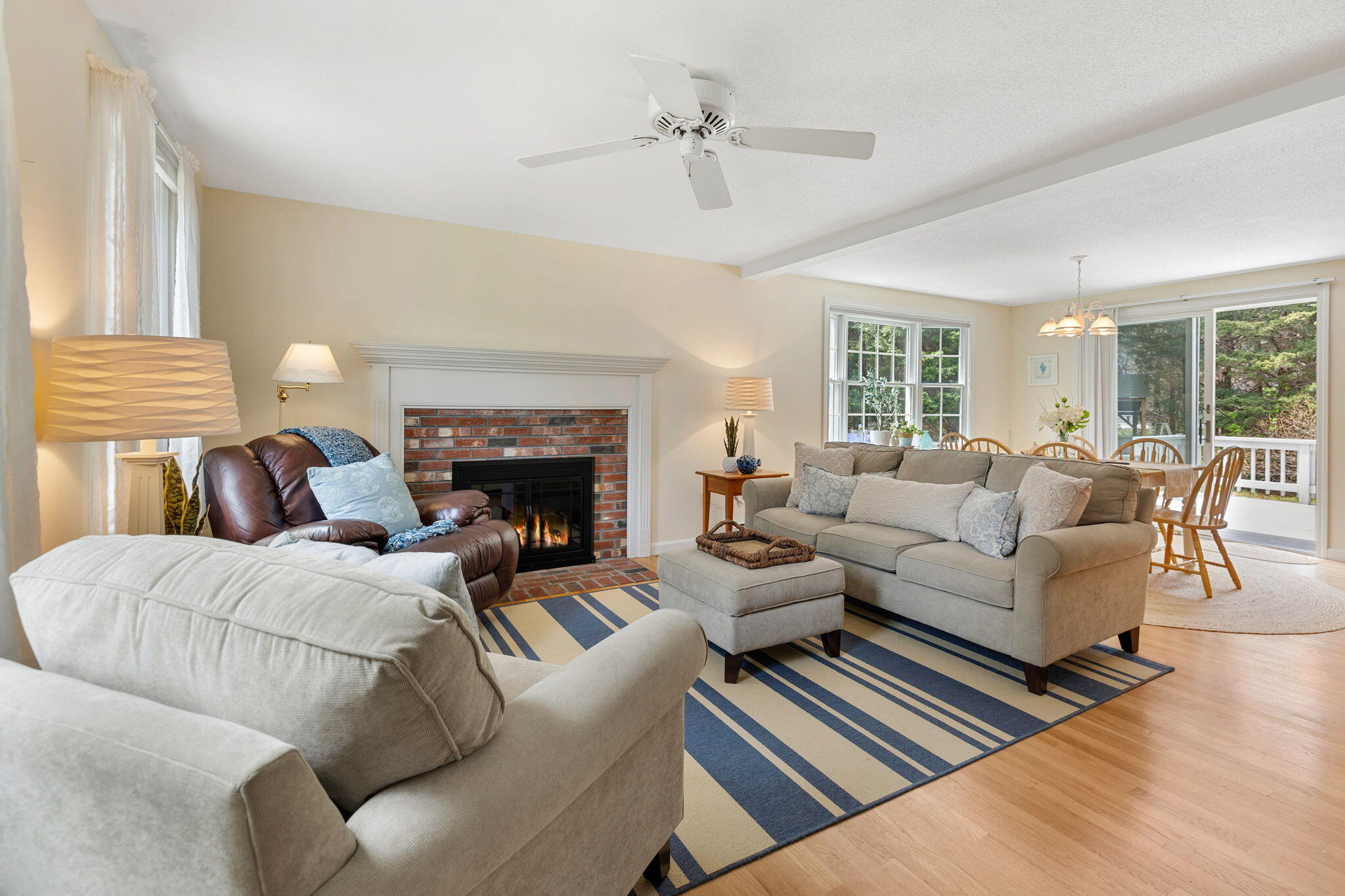 9 Raymond Way Eastham, MA 02642 - Photo 6 of 27 a living room with furniture fireplace and a window