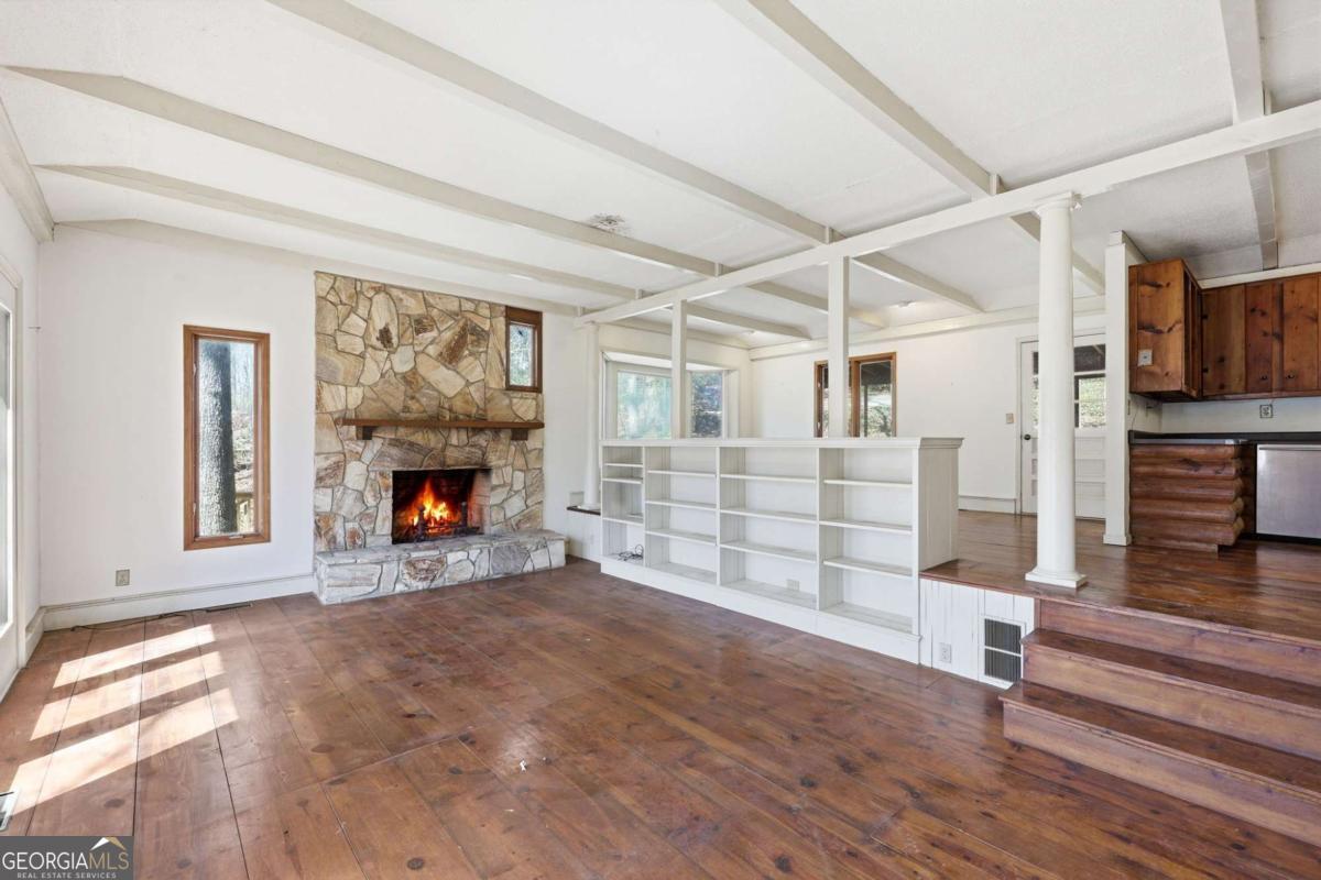 508 Providence Road Statham, GA 30666 - Photo 15 of 39 a view of empty room with wooden floor and fireplace