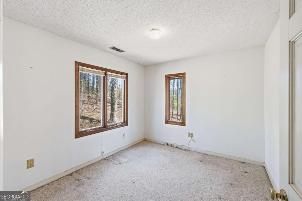 508 Providence Road Statham, GA 30666 - Photo 23 of 39 an empty room with windows