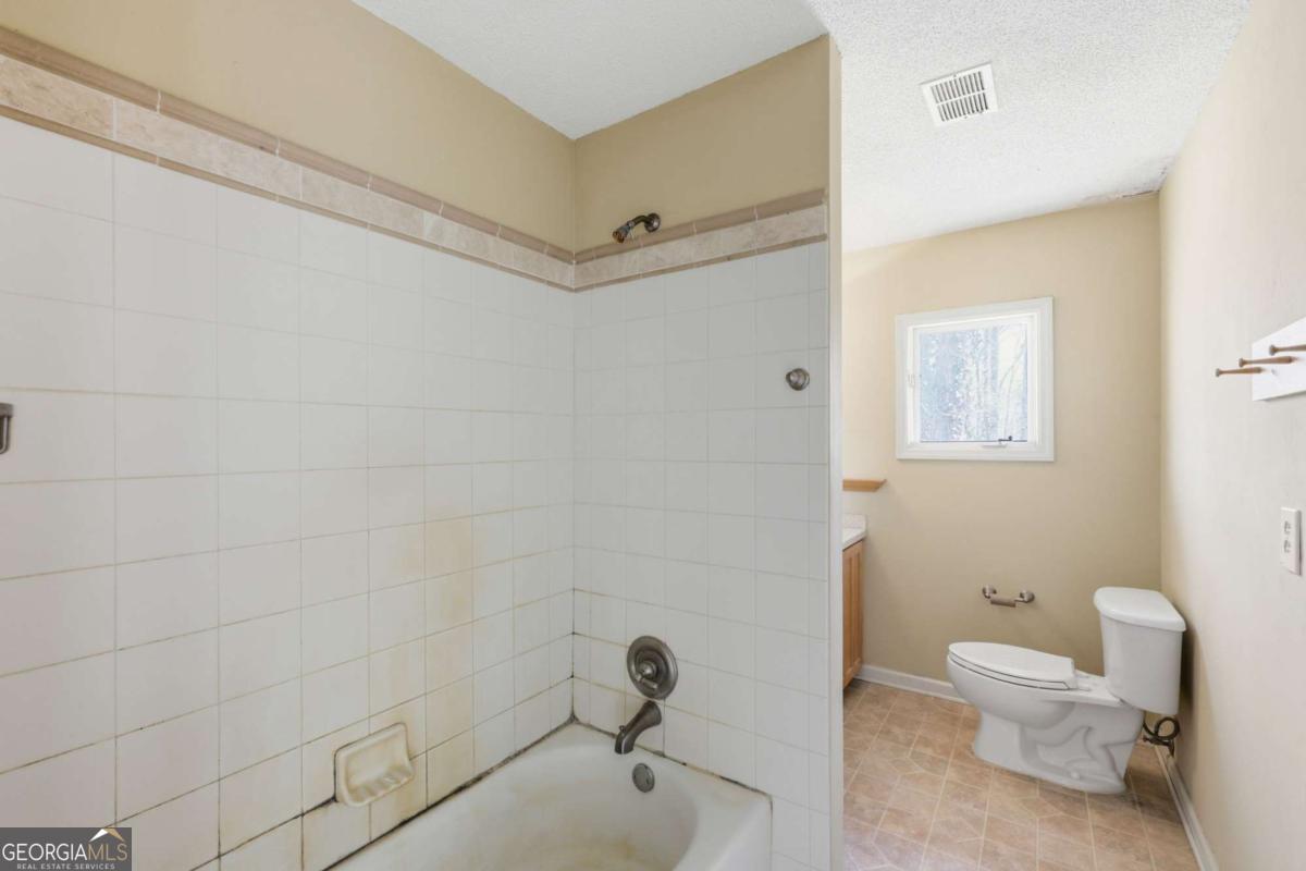 508 Providence Road Statham, GA 30666 - Photo 27 of 39 a bathroom with a toilet and a sink