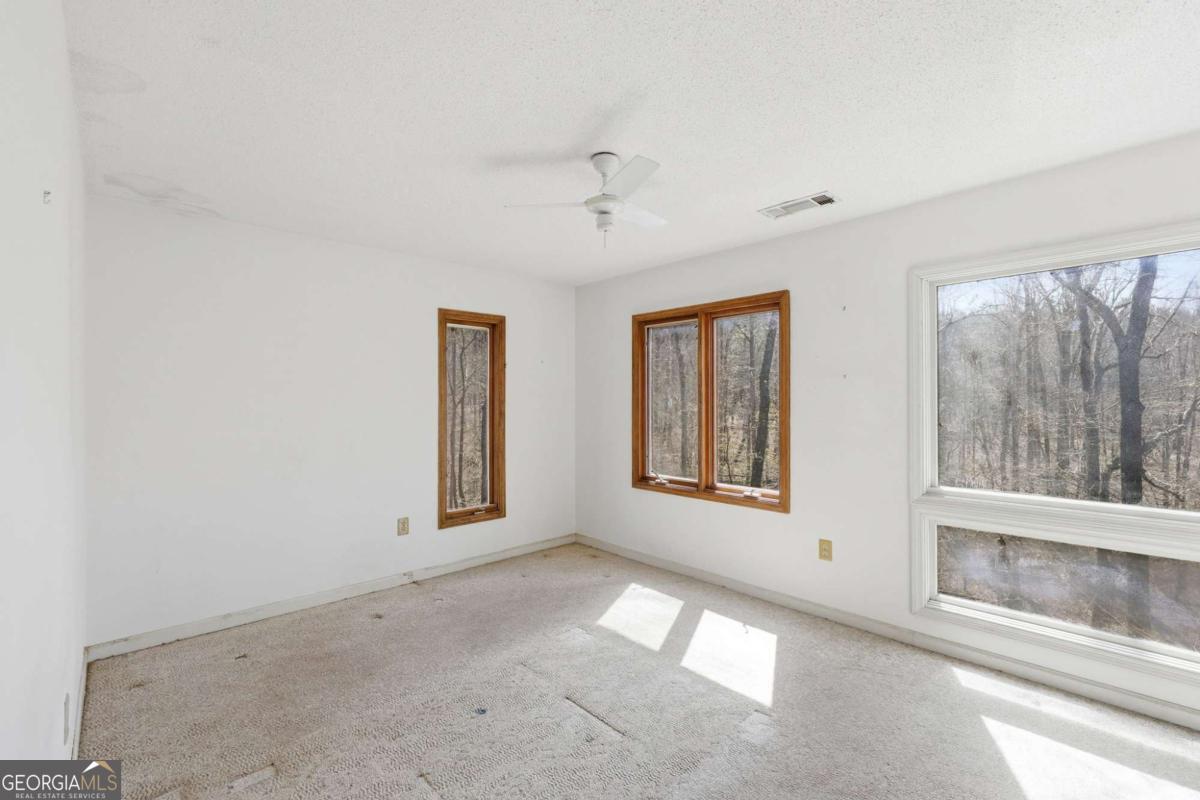 508 Providence Road Statham, GA 30666 - Photo 29 of 39 a view of an empty room with a window