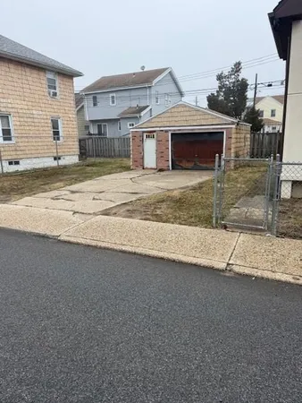 a view of a house with a sink and a yard
