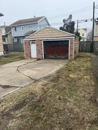 a front view of a house with a garage