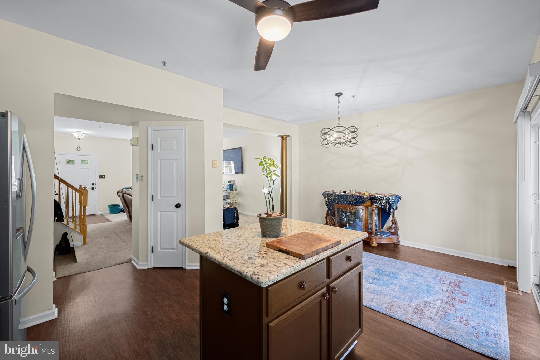 9837 Sherwood Farm Road Owings Mills, MD 21117 - Photo 12 of 35 a view of kitchen island with cabinets and wooden floor