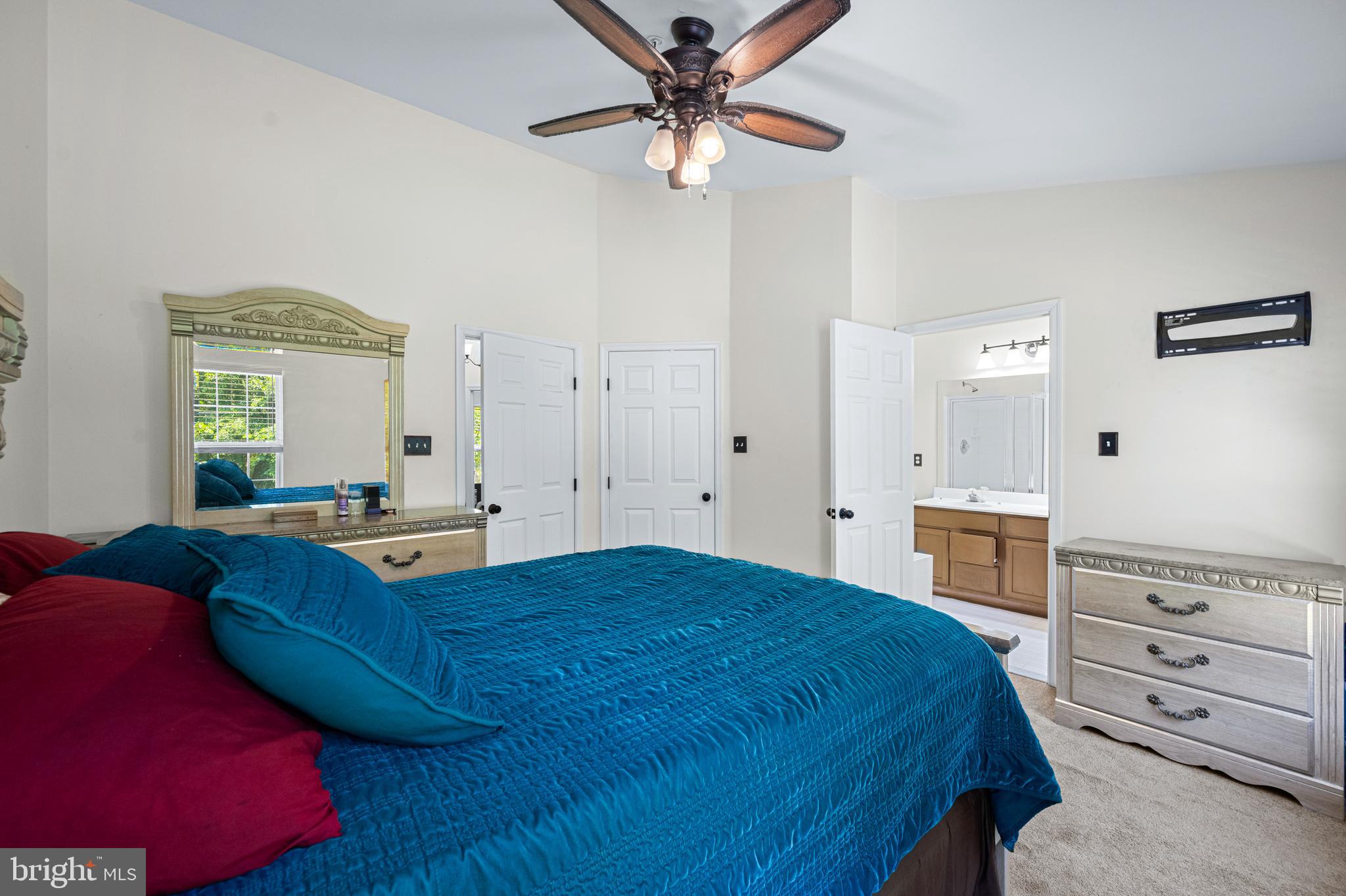 9837 Sherwood Farm Road Owings Mills, MD 21117 - Photo 22 of 35 a spacious bedroom with a bed and a dresser