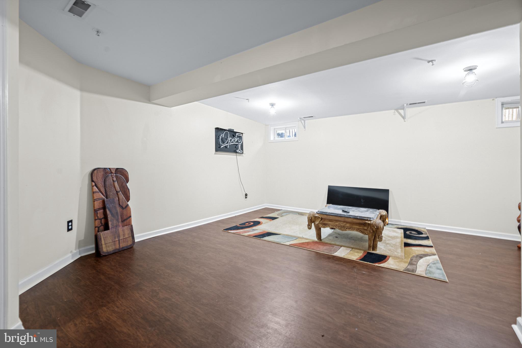 9837 Sherwood Farm Road Owings Mills, MD 21117 - Photo 24 of 35 a workspace with furniture and wooden floor