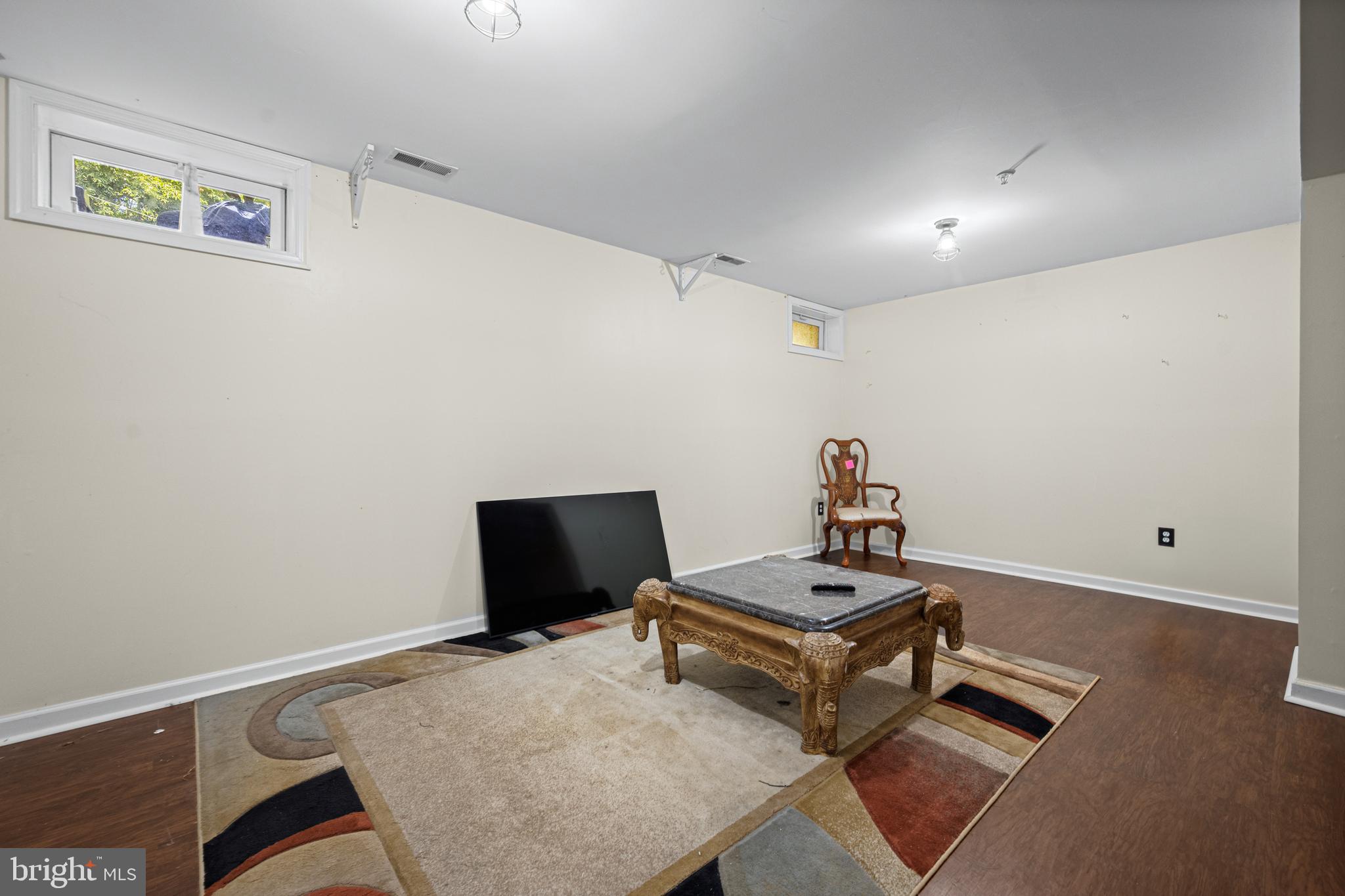 9837 Sherwood Farm Road Owings Mills, MD 21117 - Photo 26 of 35 a living room with a bed furniture and a window