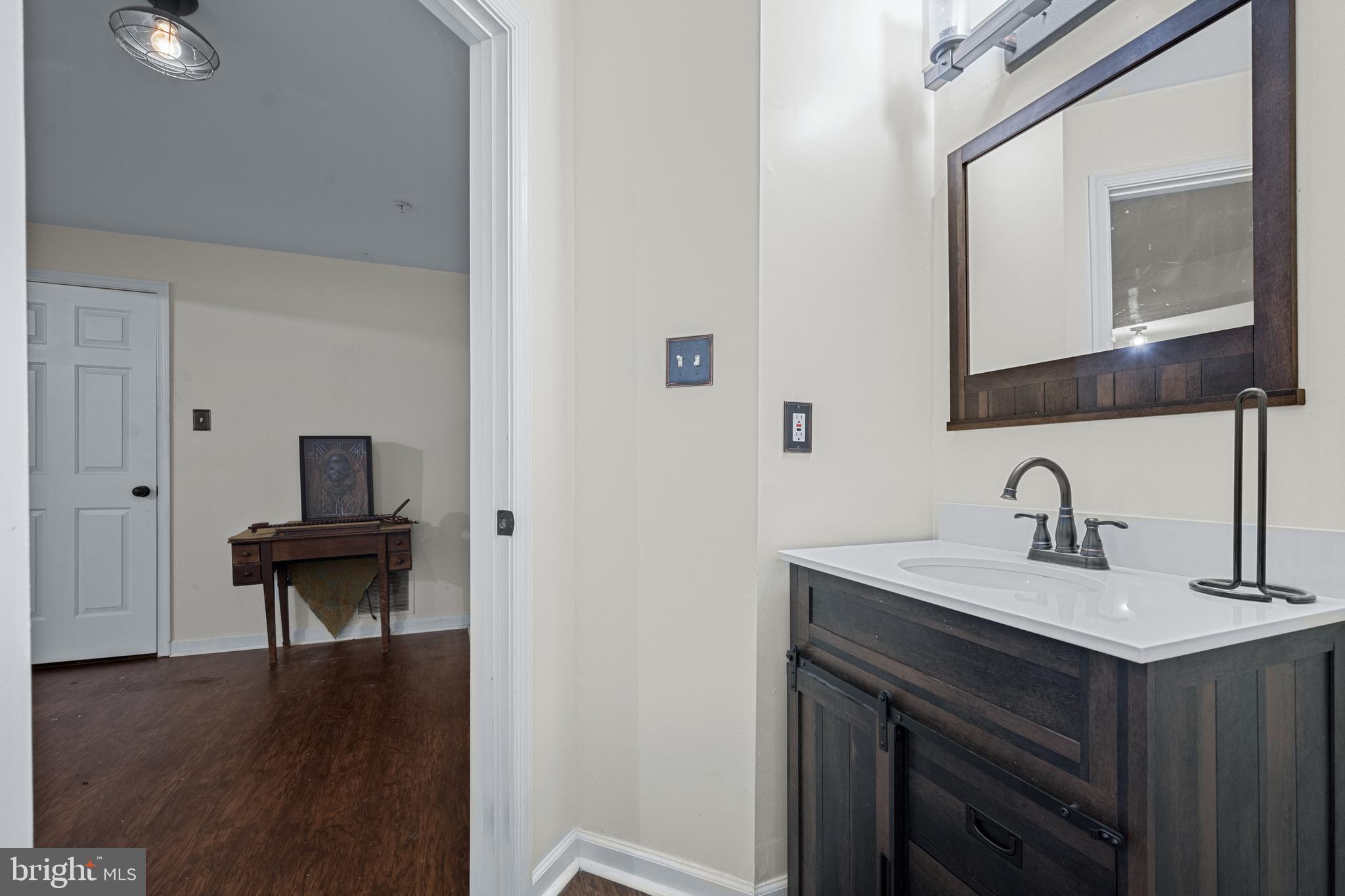 9837 Sherwood Farm Road Owings Mills, MD 21117 - Photo 27 of 35 a view of a sink and a mirror