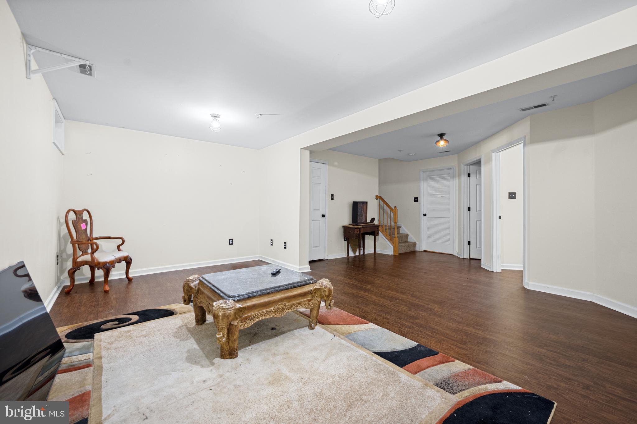 9837 Sherwood Farm Road Owings Mills, MD 21117 - Photo 28 of 35 a room with gym equipment and wooden floor