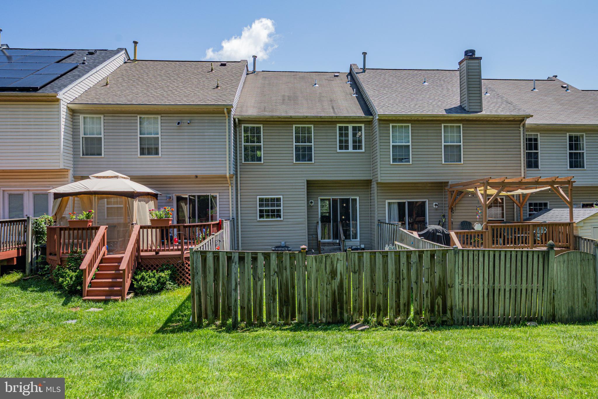 9837 Sherwood Farm Road Owings Mills, MD 21117 - Photo 33 of 35 a front view of a house with a yard