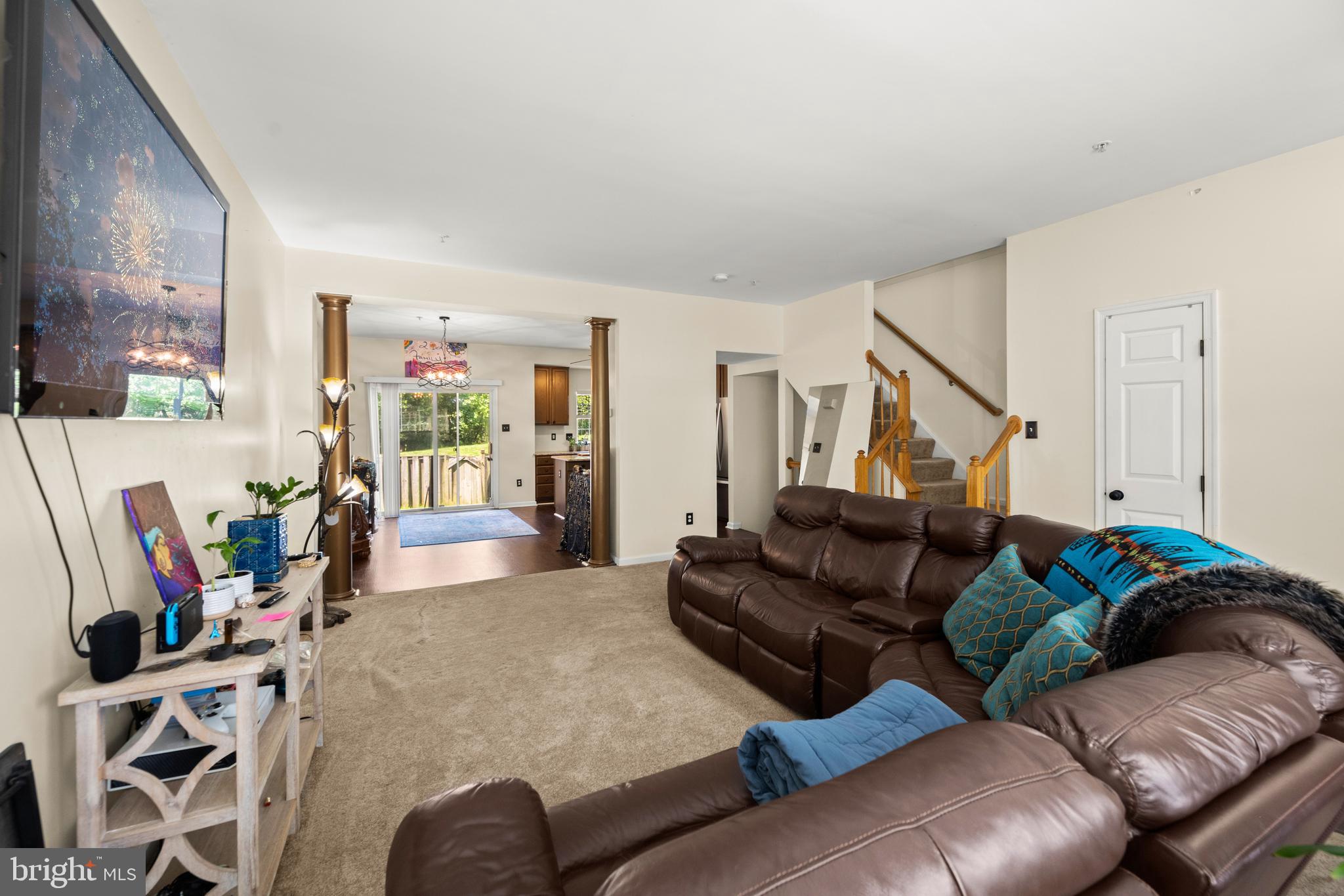 9837 Sherwood Farm Road Owings Mills, MD 21117 - Photo 7 of 35 a living room with furniture and a flat screen tv