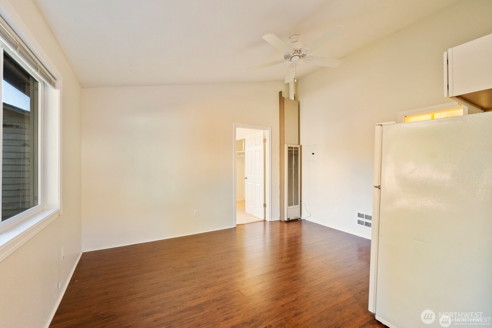 120 North 80th Street Seattle, WA 98103 - Photo 12 of 39 a view of an empty room with wooden floor and a window