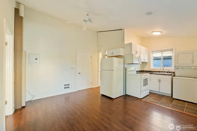 a view of kitchen with wooden floor