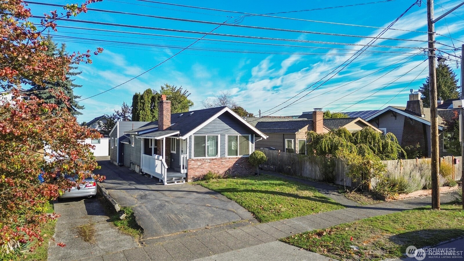 120 North 80th Street Seattle, WA 98103 - Photo 2 of 39 a front view of a house with a yard and potted plants