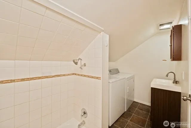 a bathroom with a shower and a sink