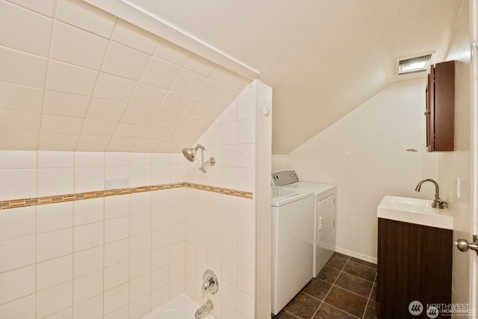 120 North 80th Street Seattle, WA 98103 - Photo 22 of 39 a bathroom with a shower and a sink
