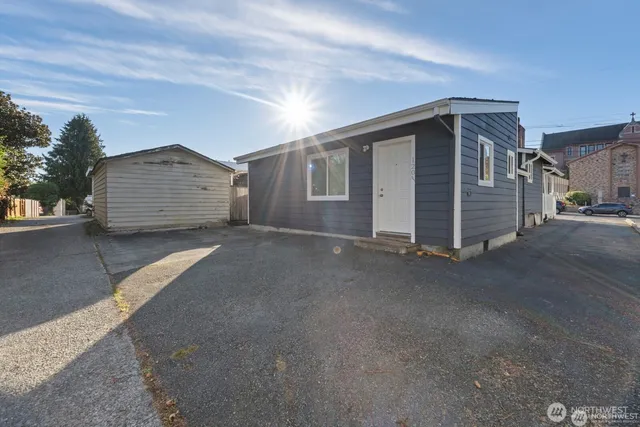 a view of a house with a street