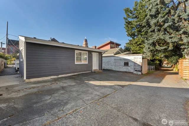 a view of a house with a yard and garage
